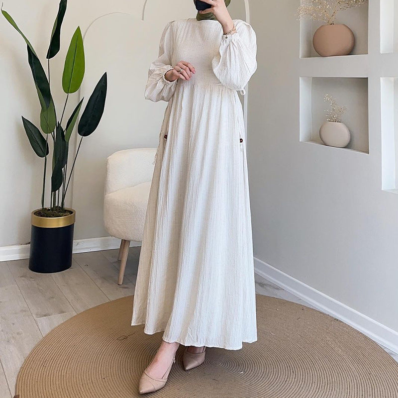 Round-necked long robe with frilled sleeves