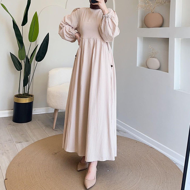 Round-necked long robe with frilled sleeves