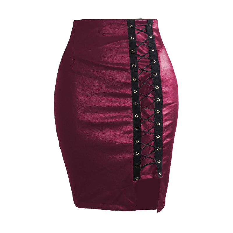 Black strapped, figure-hugging, slit leather skirt