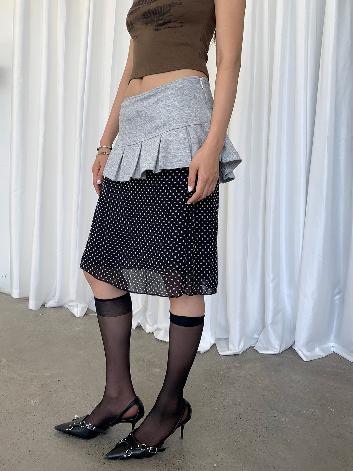 A uniquely designed, high-waisted, slimming midi skirt for women.