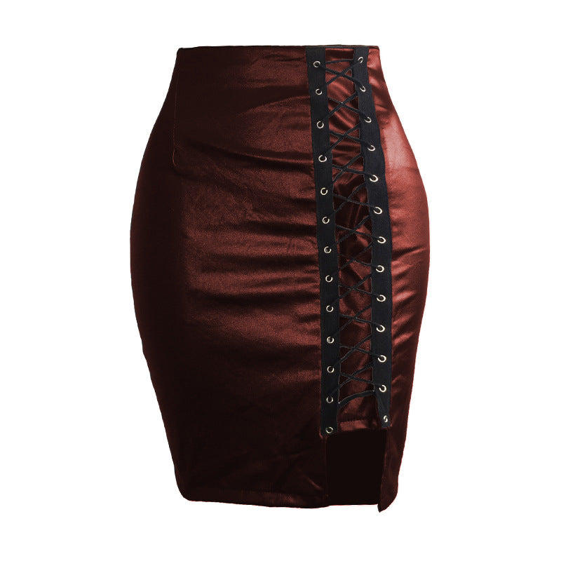 Black strapped, figure-hugging, slit leather skirt