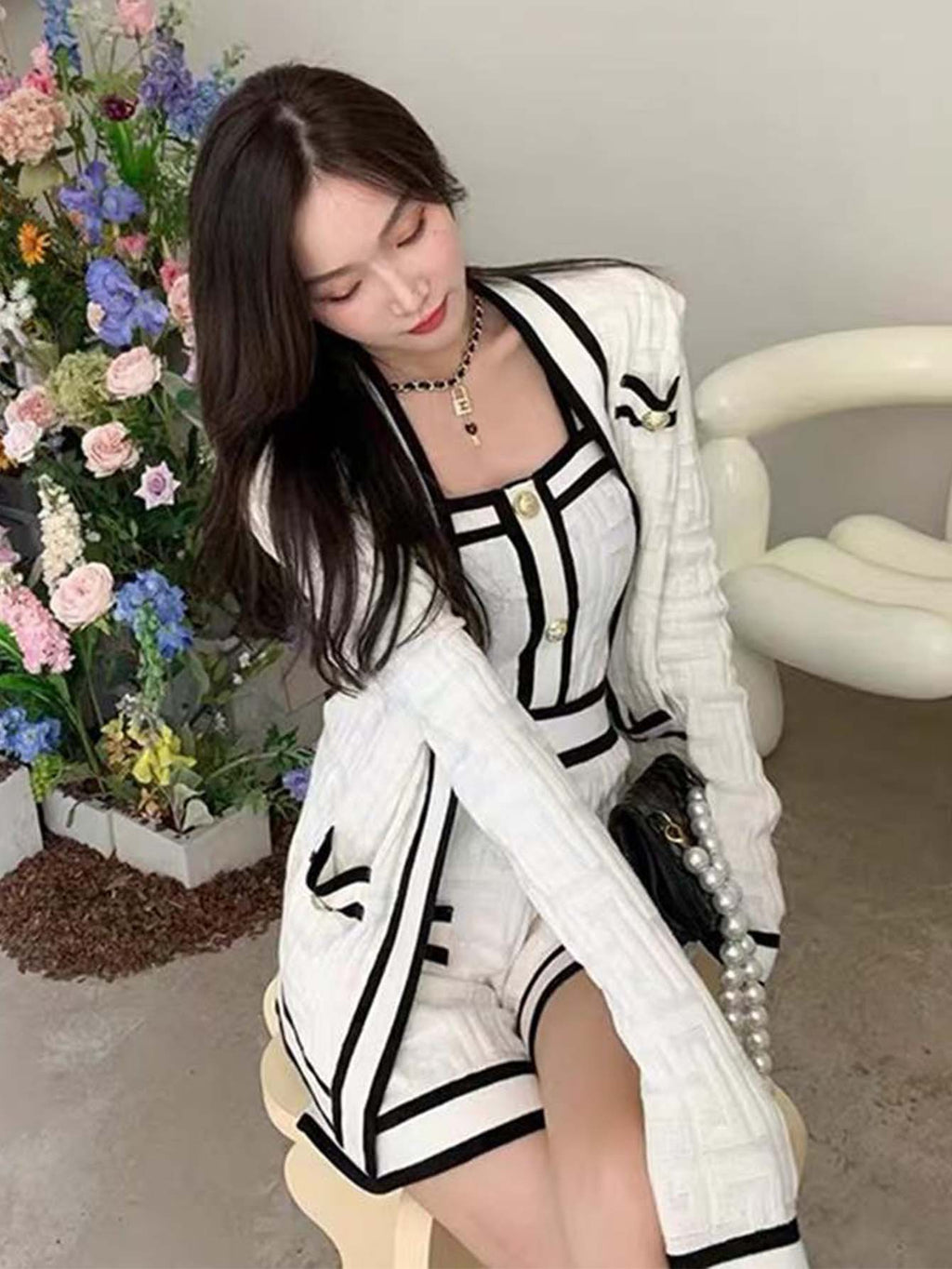 Three-piece set, knitted cardigan, top, and shorts